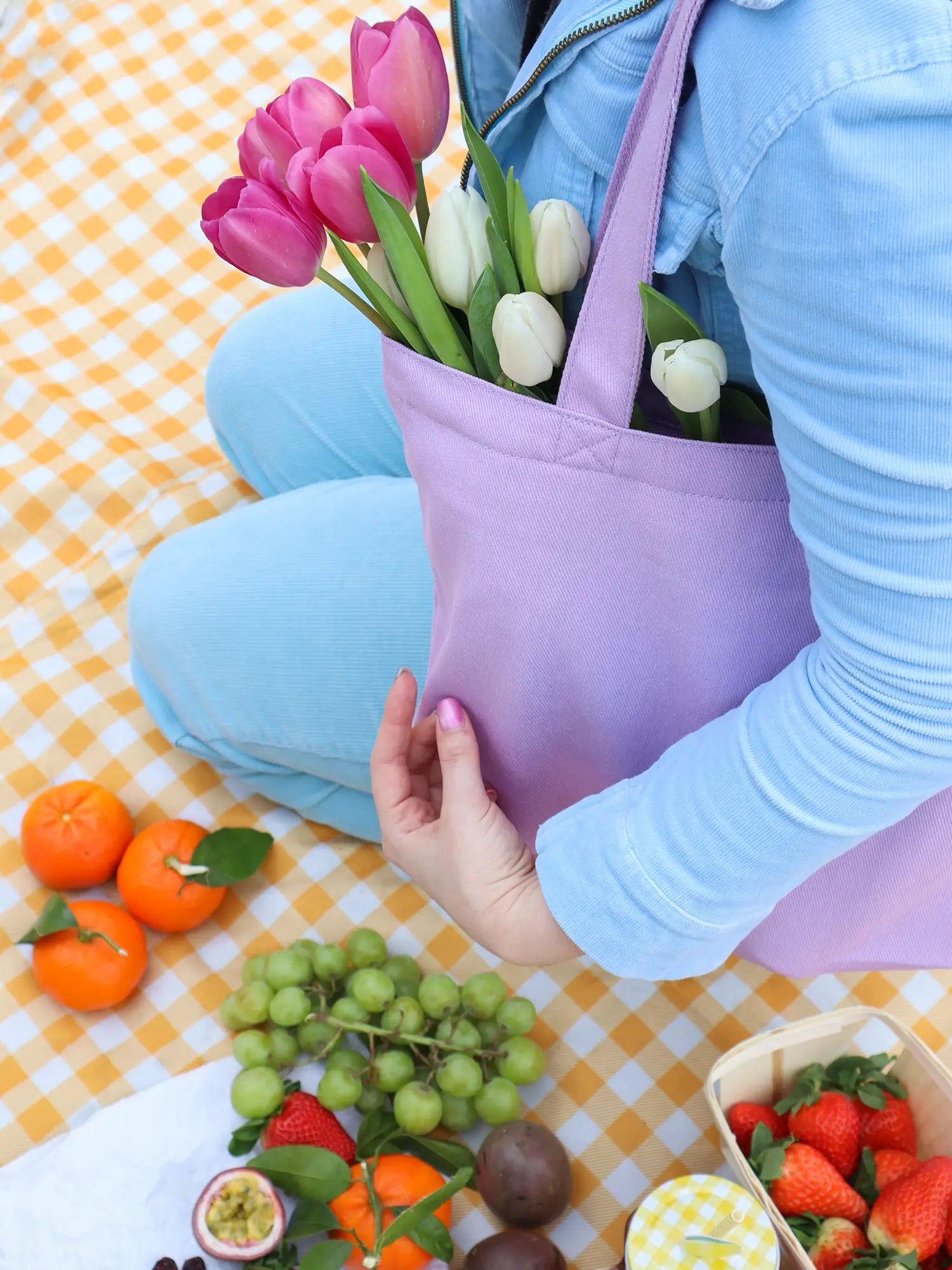 Mini Functional Tote Bags in a picnic setting aesthetic picture from The Tote Library with tulips in the bag